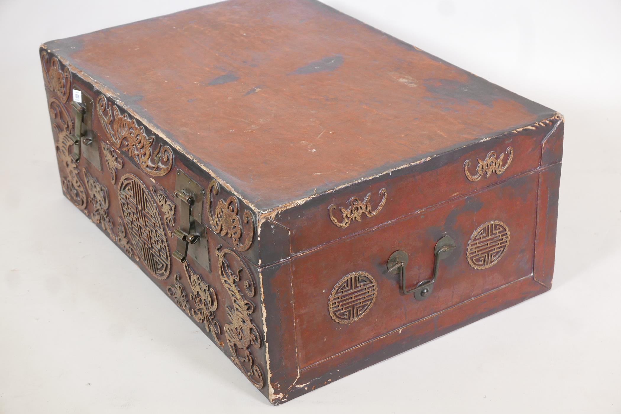 A chinoiserie lacquered pigskin trunk, with parcel gilt raised moulded decoration and brass - Image 2 of 5