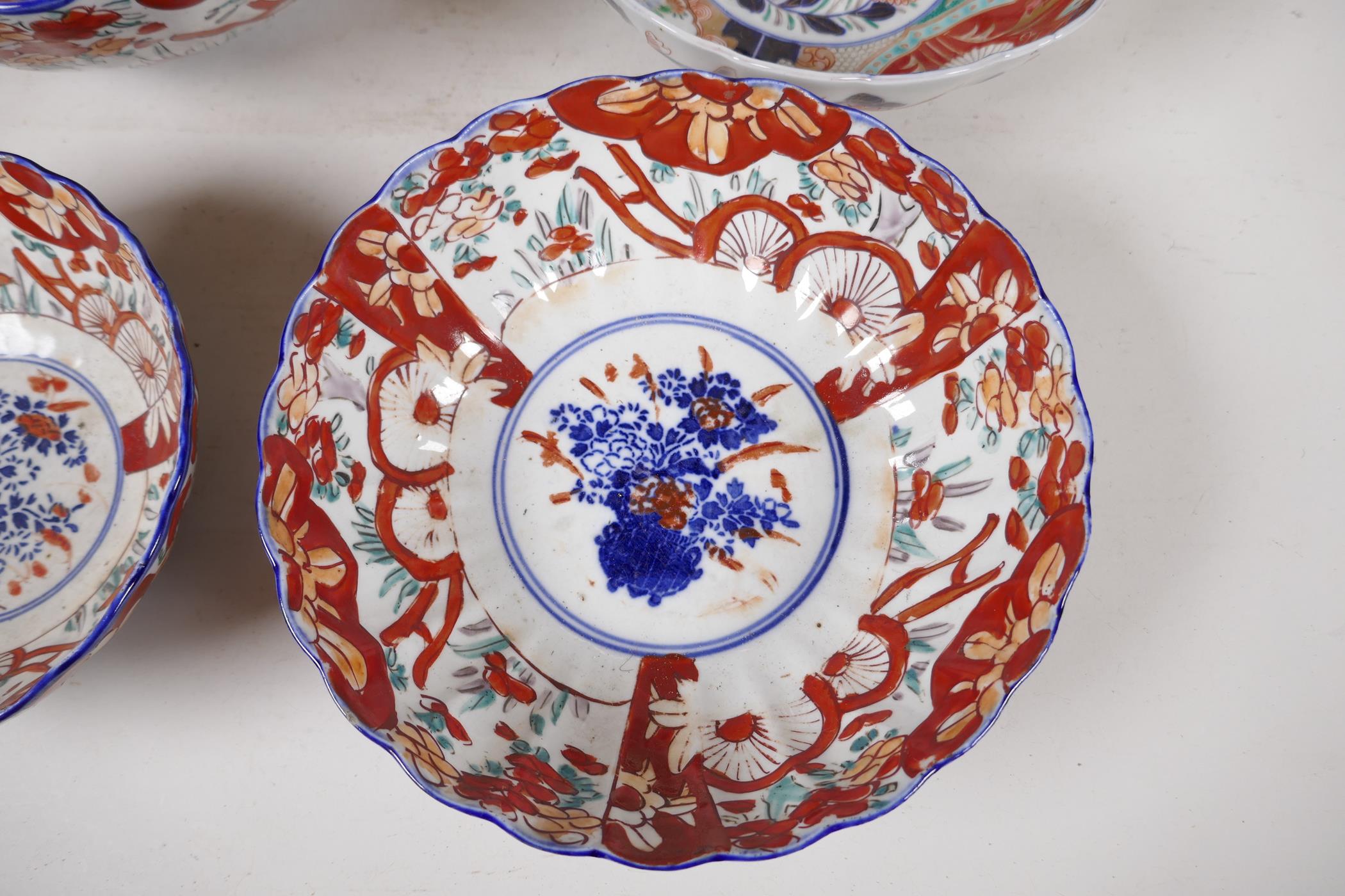 Four C19th Imari porcelain bowls decorated with traditional patterns, largest 10" diameter - Image 4 of 5