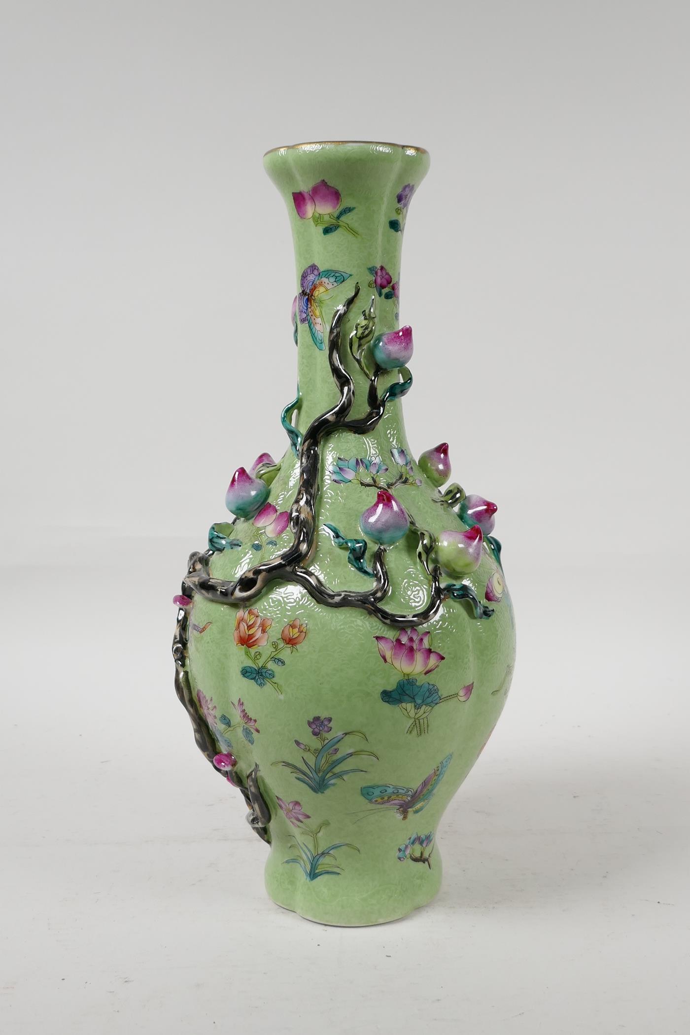 A Chinese polychrome porcelain vase with applied peach tree decoration on a green ground, seal - Image 2 of 6