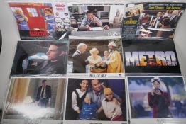 A collection of lobby cards for the films Baseketball Minority Report, Presumed Innocent, All of Me,