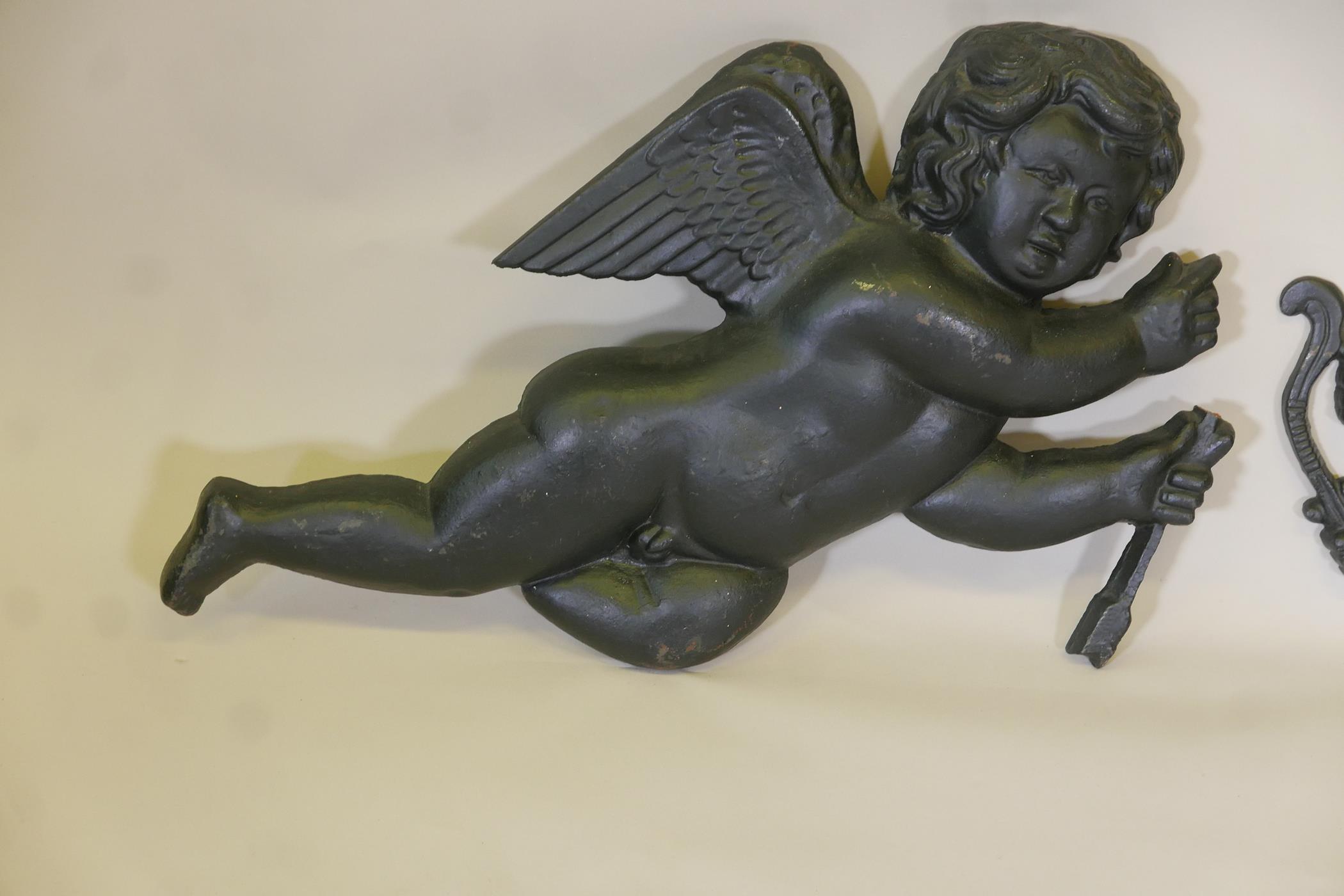 A pair of painted cast iron wall plaques in the form of cherubs, A/F, 28" long - Image 2 of 5