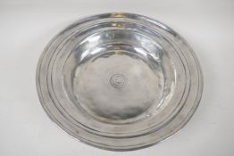 A C19th French polished pewter bowl with spun rim, 13" diameter
