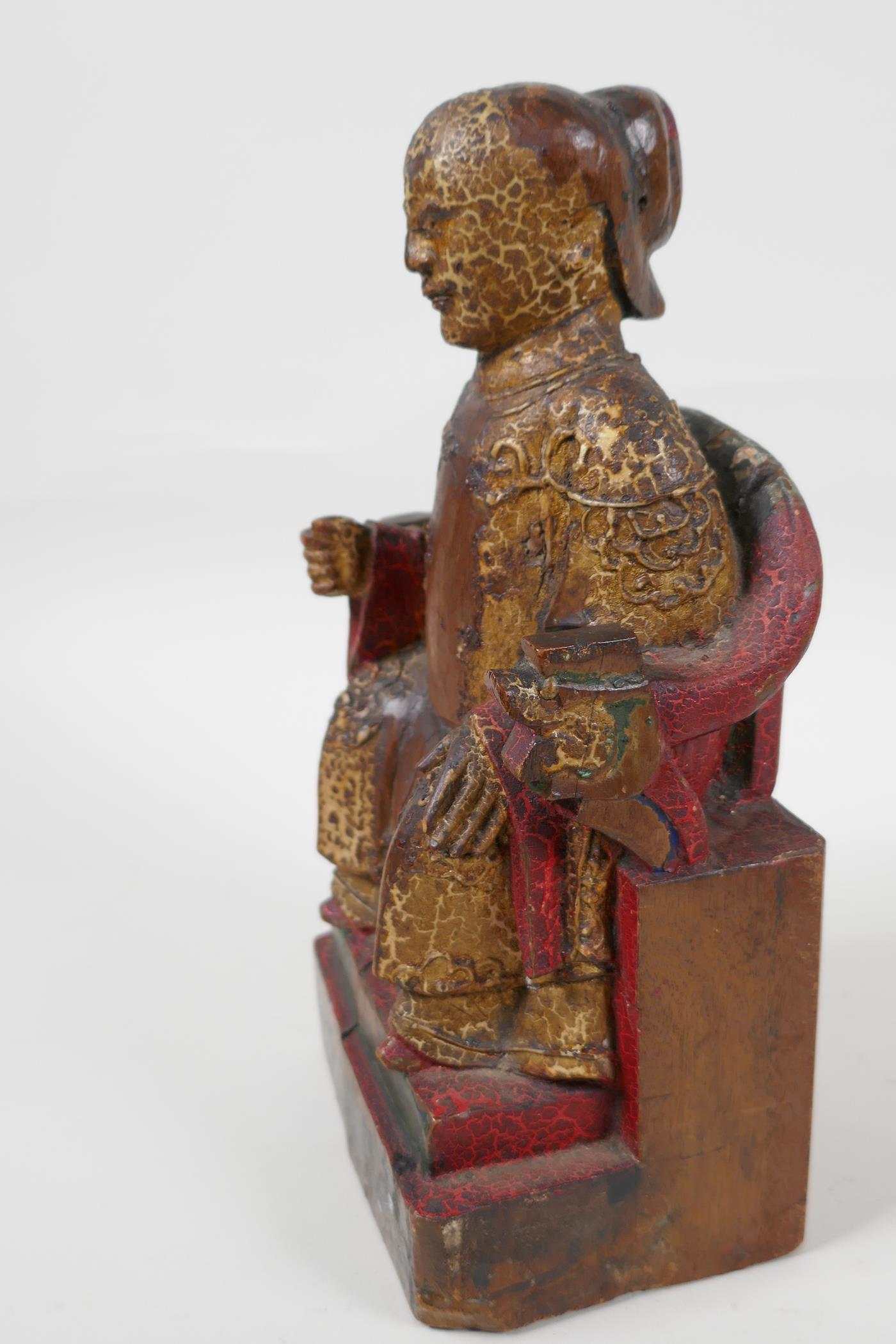 A Chinese carved wood figure of a dignitary seated on a throne, traces of paint, 9" high - Image 3 of 6