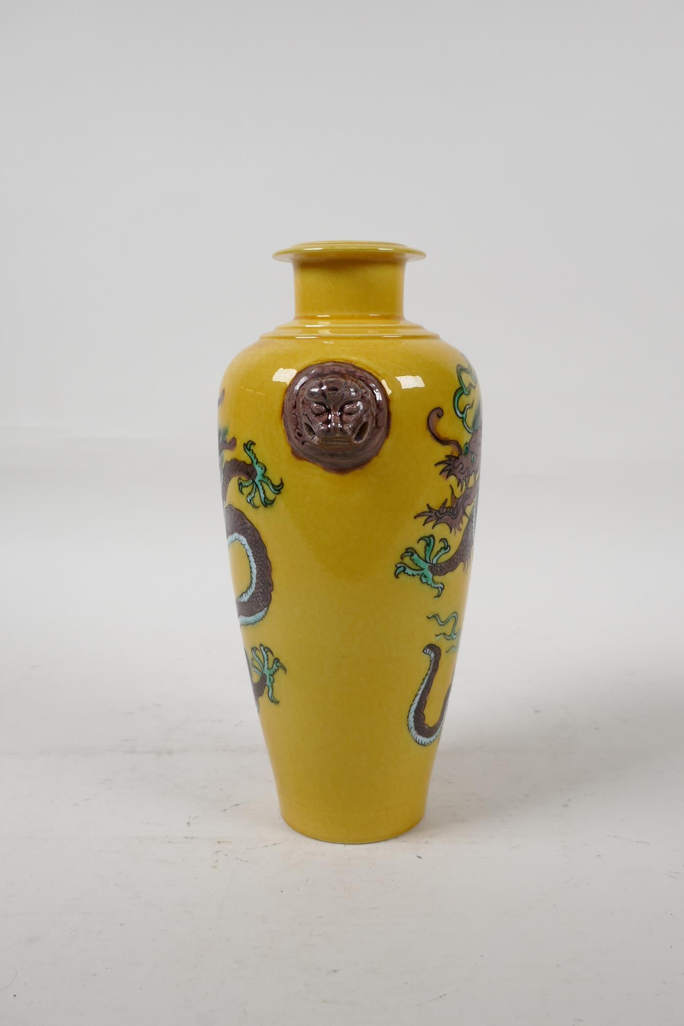 A Chinese Sancai glazed porcelain vase with two lion mask handles and dragon decoration, six - Image 4 of 5