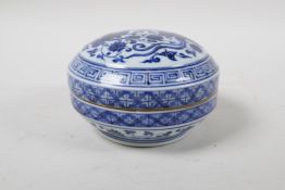 A Chinese blue and white porcelain cylinder box and cover, with lotus flower and phoenix decoration,