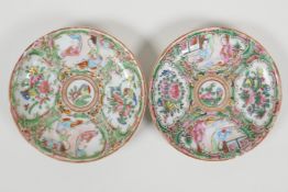 A pair of early C20th Canton famille rose saucers decorated with figures and flowers, 4½" diameter