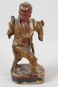An antique painted Chinese carved wood figure of an angry man, A/F, 9" high