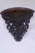 A C19th mahogany corner wall bracket with well carved decoration, 14" x 16"