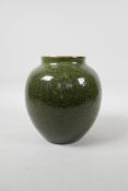 A Chhinese green speckle glazed pottery jar, 7" high