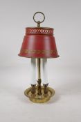 A brass three light lamp with toleware shade, 14" high