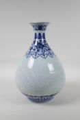 A Chinese blue and white porcelain pear shaped vase, with raised white enamel leaf decoration, six
