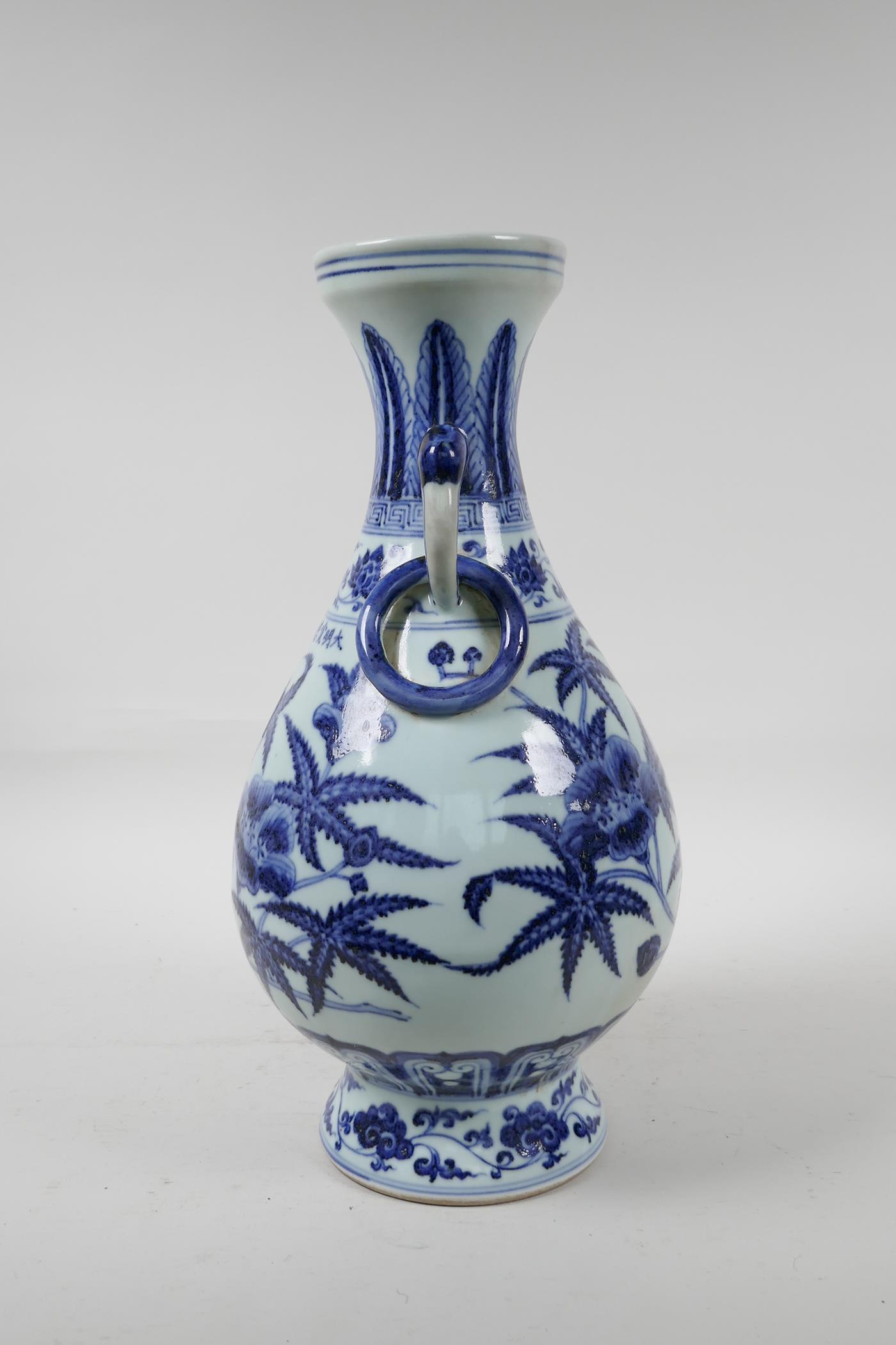 A blue and white porcelain vase with floral decoration, Chinese six character mark to side, 13½" - Image 4 of 6