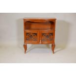 An early C20th Danish inlaid solid satinwood two door glazed side cabinet on carved cabriole