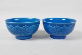 A pair of blue glazed porcelain rice bowls of lotus flower form, Chinese Qianlong seal mark to base,