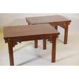 A pair of Chinese hardwood side tables with carved stylised elephant head decoration, A/F, 38" x 26"