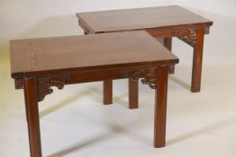 A pair of Chinese hardwood side tables with carved stylised elephant head decoration, A/F, 38" x 26"