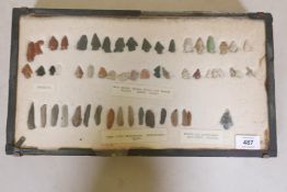 An antique collection of Neolithic flint and obsidian arrowheads, labelled Deer Creek, Salmon River,
