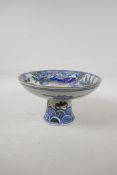 A Chinese polychrome porcelain stem bowl decorated with kylin and phoenix, 5" high, 8 ½" diameter