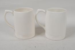 Two Wedgwood Keith Murray tankards, 4½" high