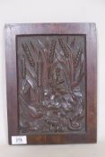 An antique mahogany panel, well carved with a serpent, bird and butterfly under reeds, 12" x 9"