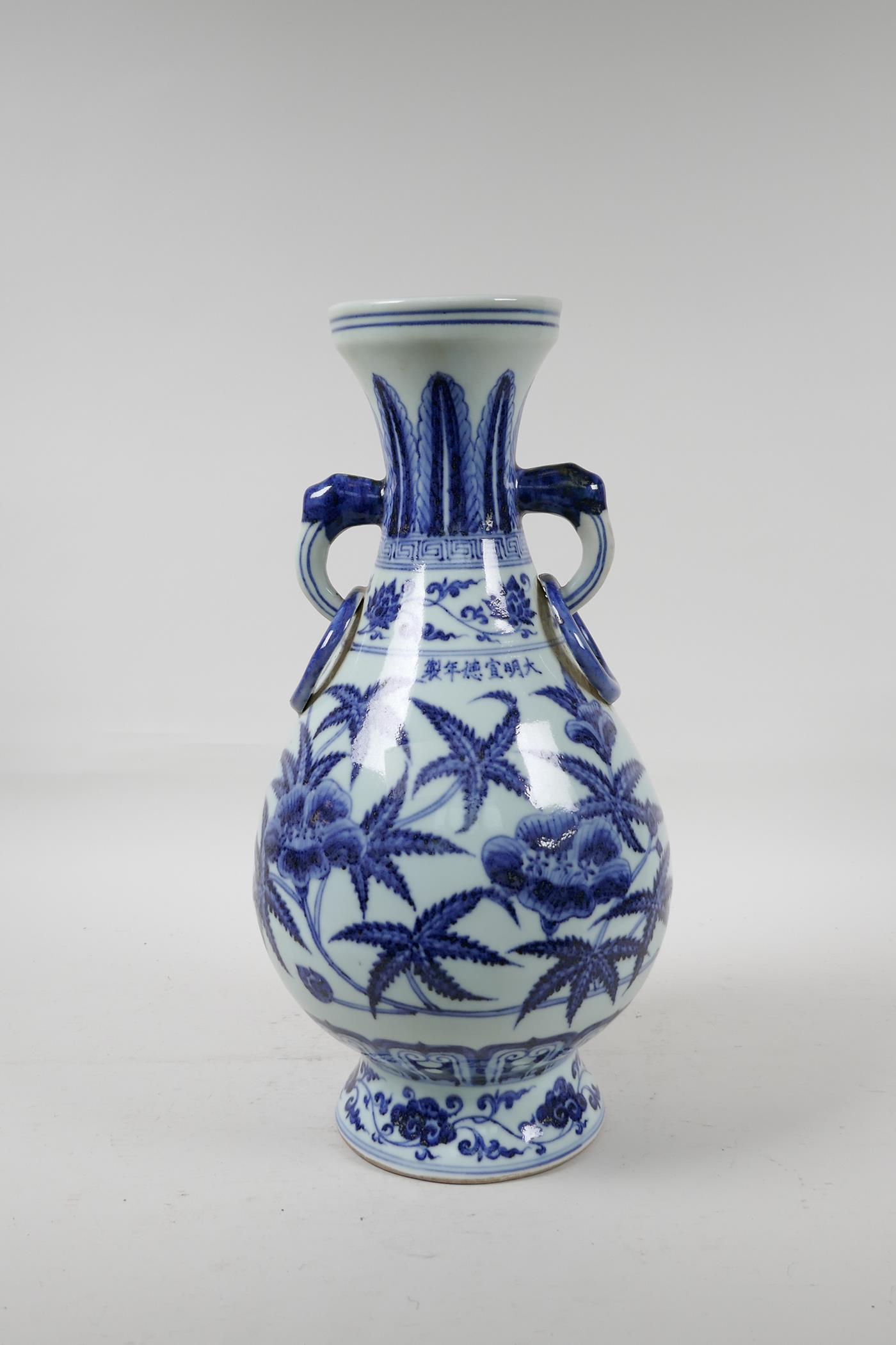 A blue and white porcelain vase with floral decoration, Chinese six character mark to side, 13½" - Image 3 of 6