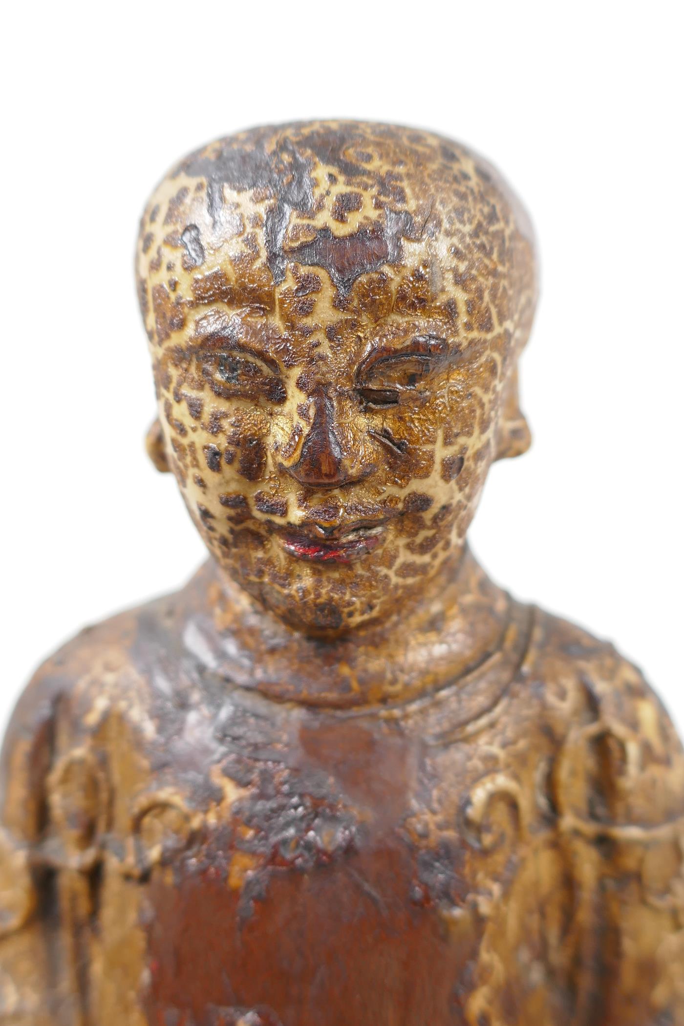 A Chinese carved wood figure of a dignitary seated on a throne, traces of paint, 9" high - Image 6 of 6