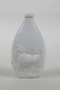 A Chinese hard paste snuff bottle with moulded cockerel decoration, impressed seal mark to base,