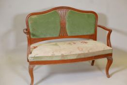 An early C20th Danish inlaid solid satinwood canape and matching chair with a pierced splat back,