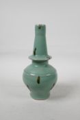 A Chinese green glazed porcelain vase with brown drip glaze detail, 8½" high