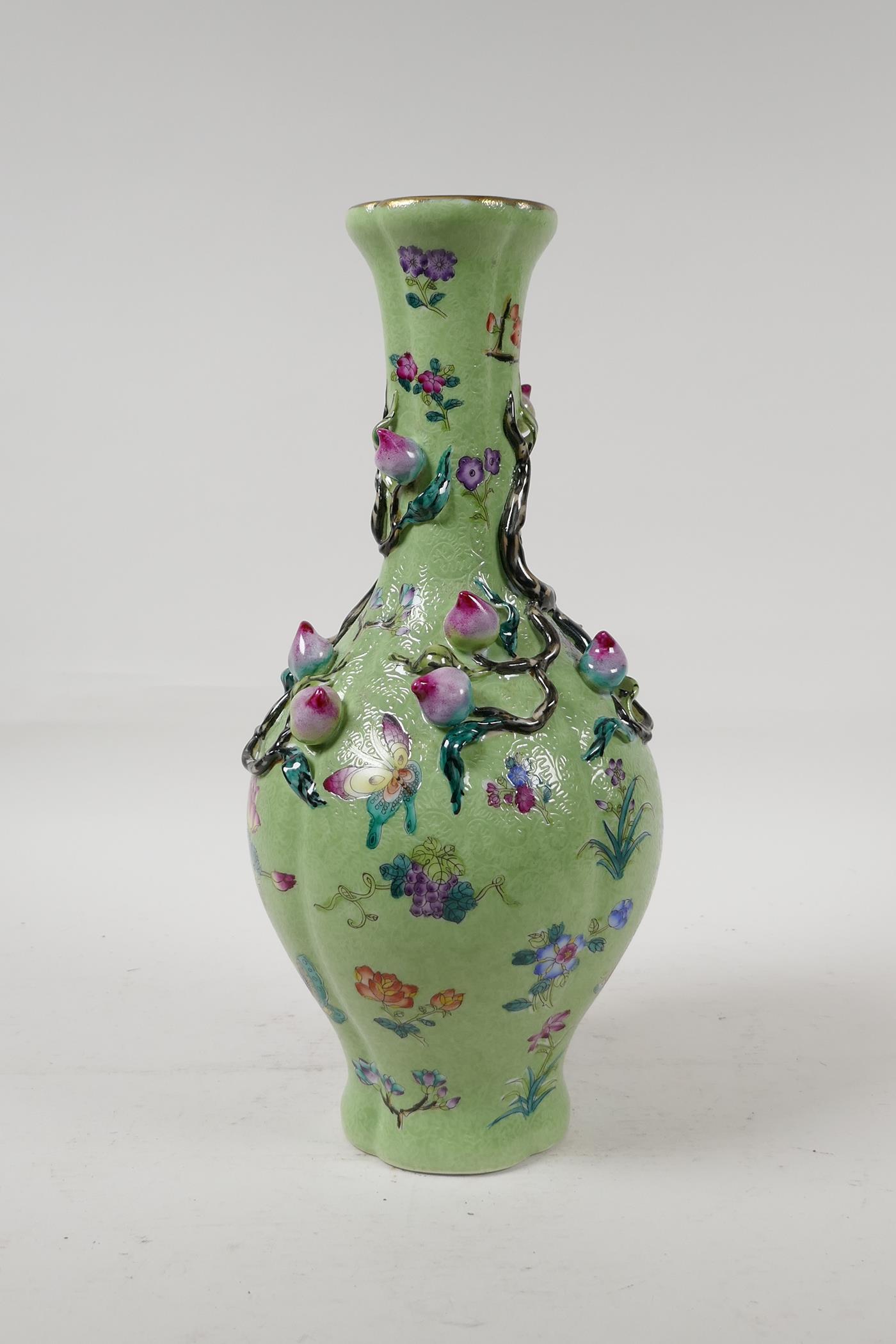 A Chinese polychrome porcelain vase with applied peach tree decoration on a green ground, seal - Image 3 of 6