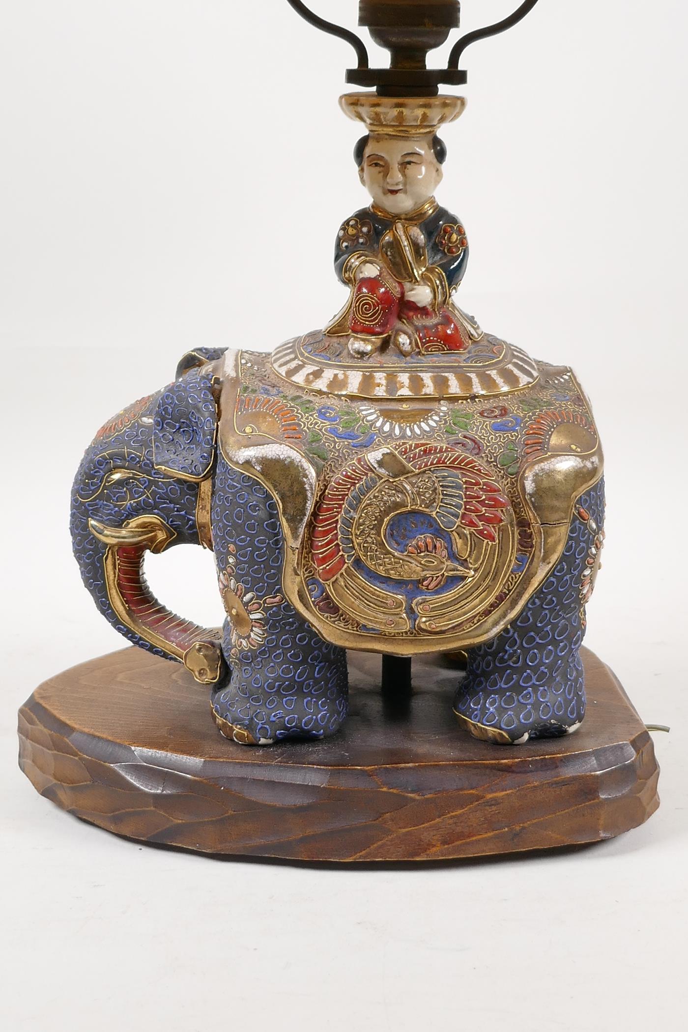 An oriental pottery lamp in the form of a child riding an elephant, 17" high - Image 2 of 4