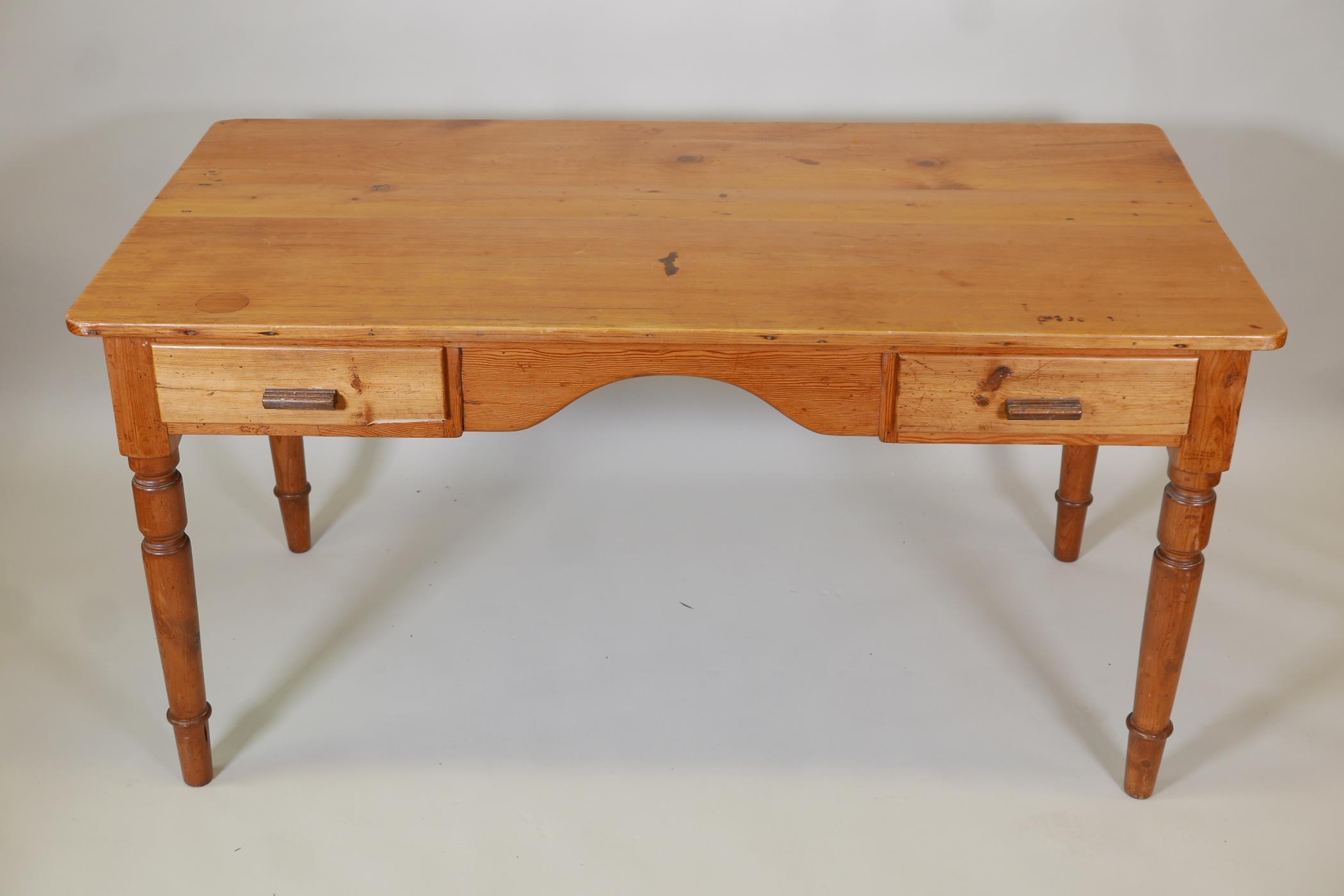 A pine two drawer writing table with two frieze drawers on turned supports, 30" high, 59" wide, - Image 2 of 3