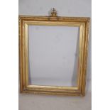 A C19th gilt picture frame with crown and cushion finial, aperture 27" x 33"