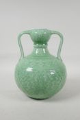 A Chinese green glazed porcelain garlic head vase, with underglaze lotus flower decoration, seal