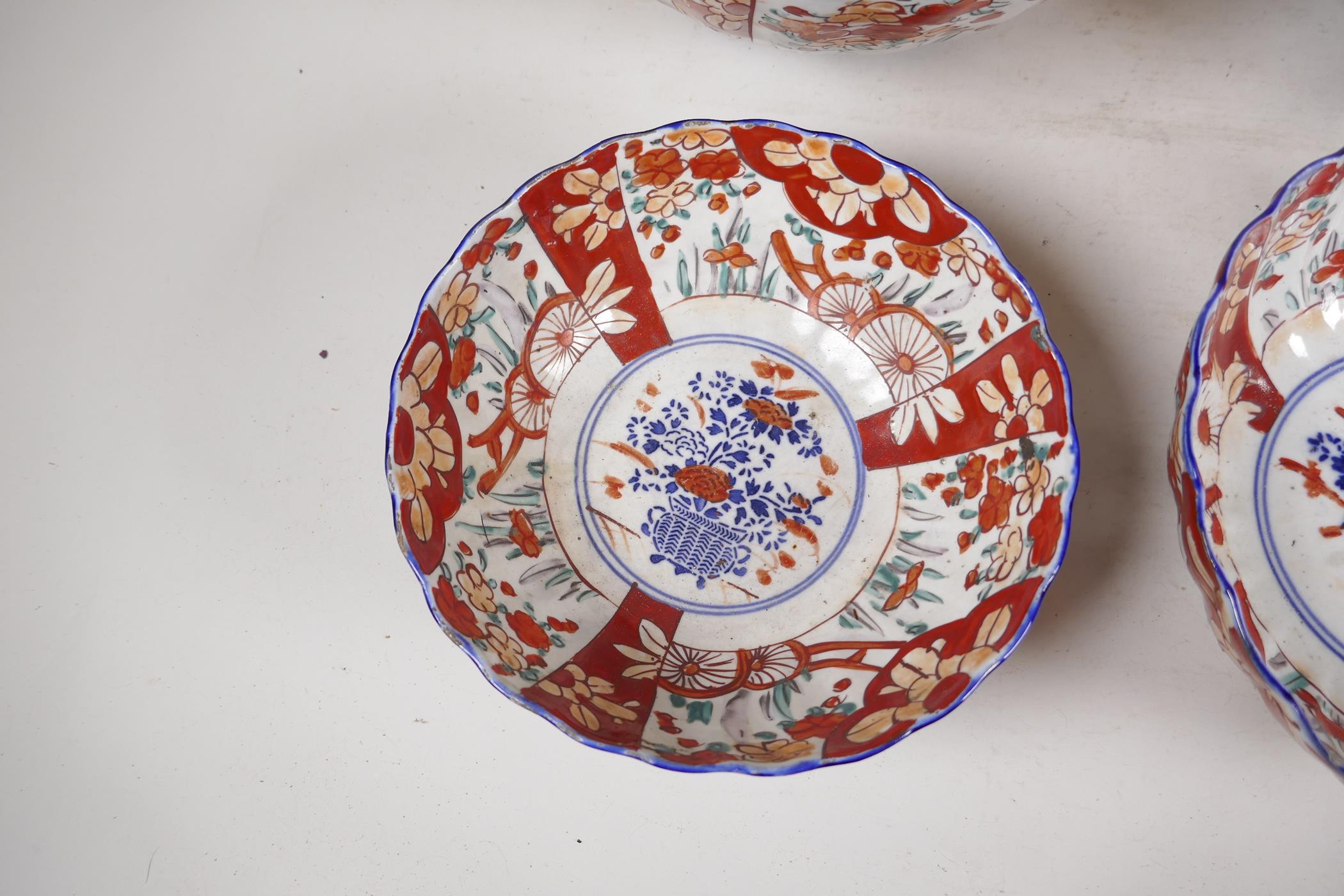 Four C19th Imari porcelain bowls decorated with traditional patterns, largest 10" diameter - Image 5 of 5