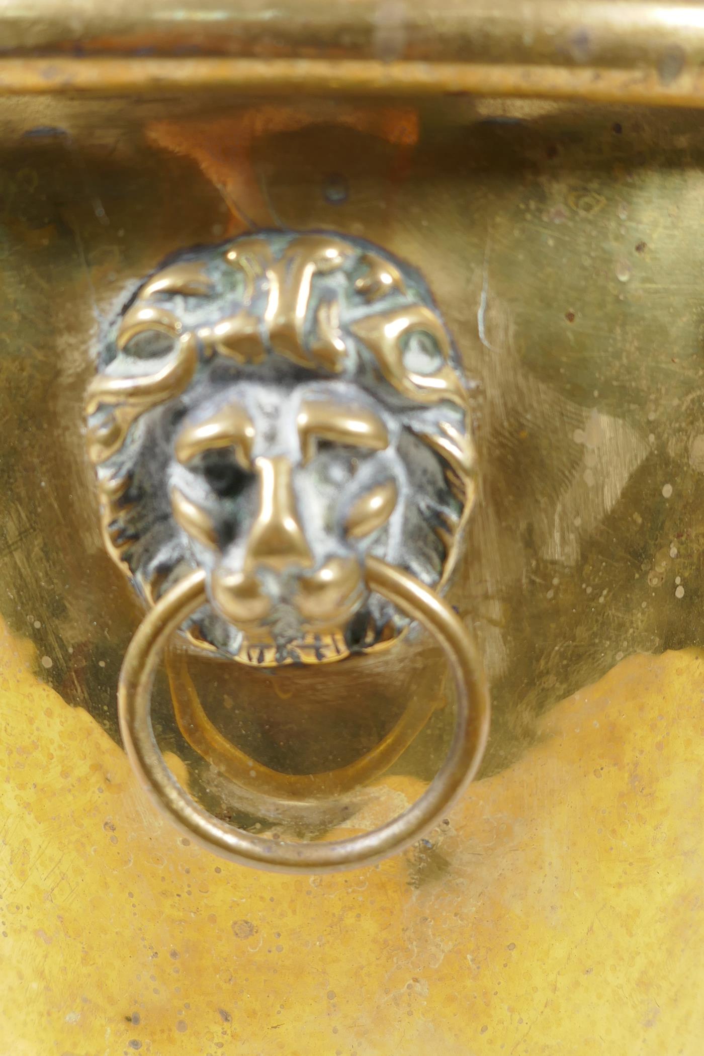 A C19th polished brass jardiniere with lion mask handles and three paw feet, 9" high - Image 3 of 4