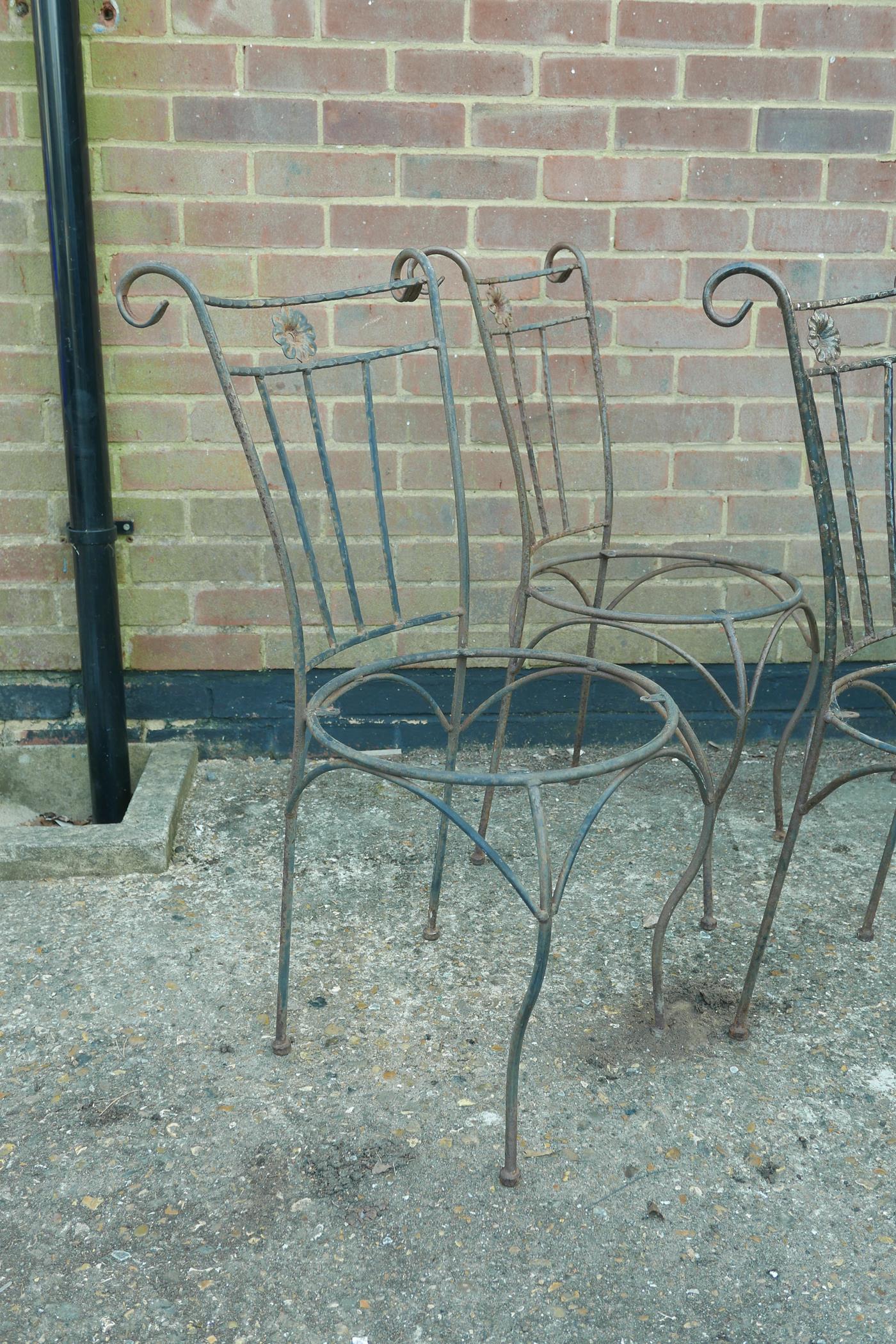 A set of six wrought iron garden chairs and matching table base, A/F lack seats - Image 2 of 4