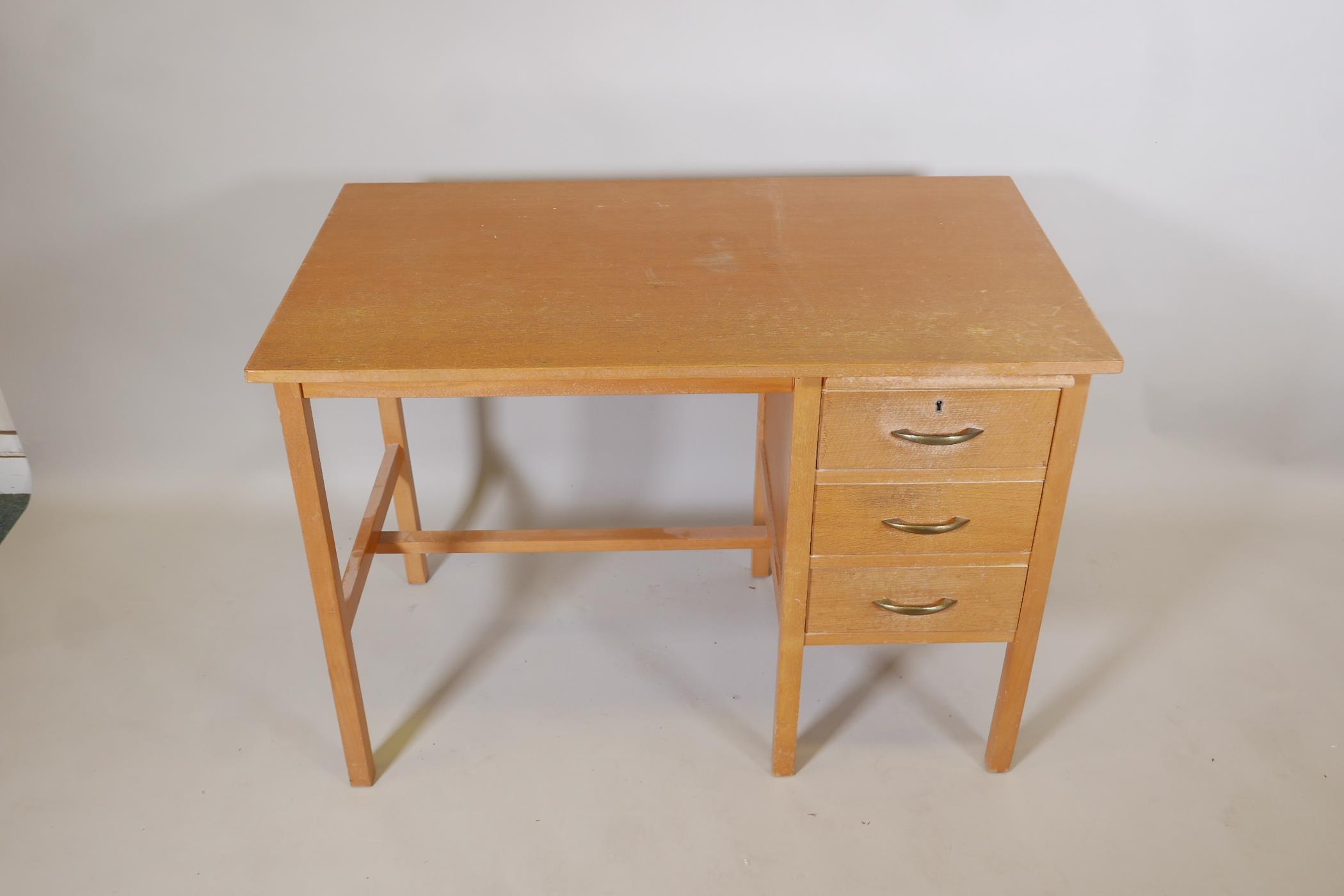 A light oak utilitarian three drawer desk with a stationery slide, 42" x 24", 30" high - Image 2 of 3