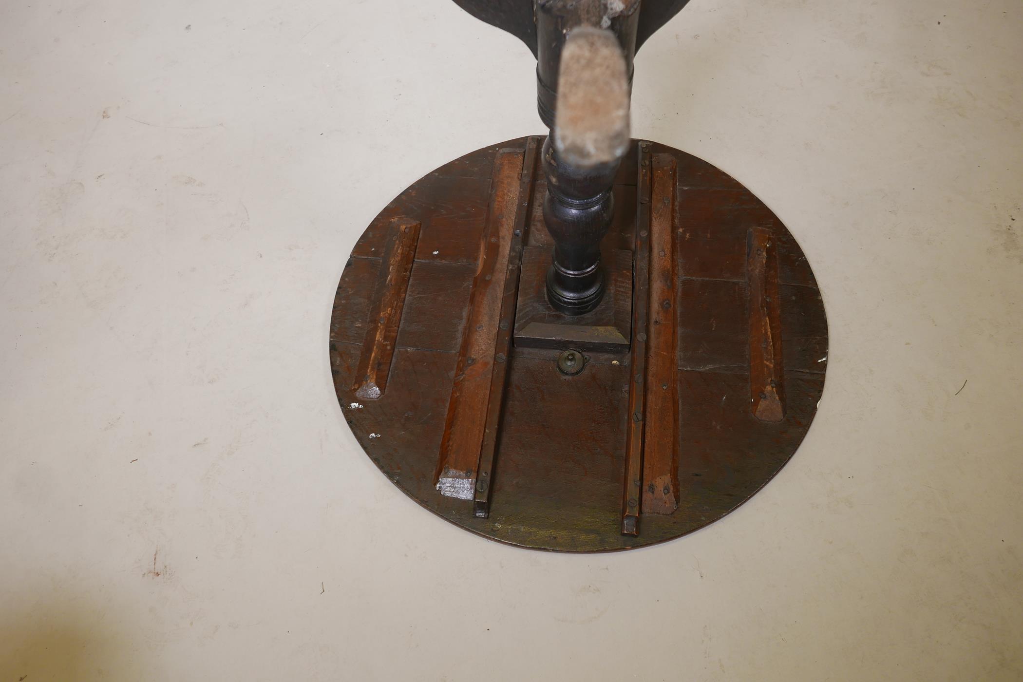 An C18th oak tilt top table raised on a turned column and tripod supports, (top fixed), 30" diameter - Image 4 of 4