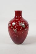 A Chinese porcelain vase with a red and green mottled glaze, six character mark to base, 6½" high"