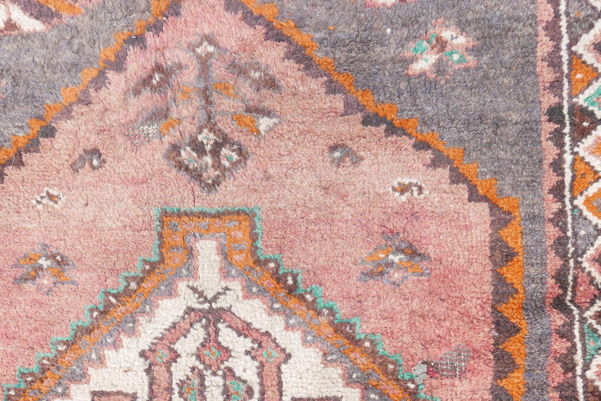 A full pile grey ground Afghan Belouch nomadic rug with pink medallion design and pink border, A/F - Image 5 of 5