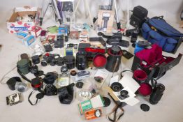 A quantity of photography equipment, tripods, lightmakers, lenses by Canon, Yashica, Minolta,