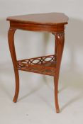 An early C20th Danish inlaid sold satinwood shaped top two tier table, the lower section with