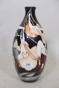 A Moorcroft trial vase with trapeze artist design, marked to base Trial, 20.3.14 with monogram, 12½"