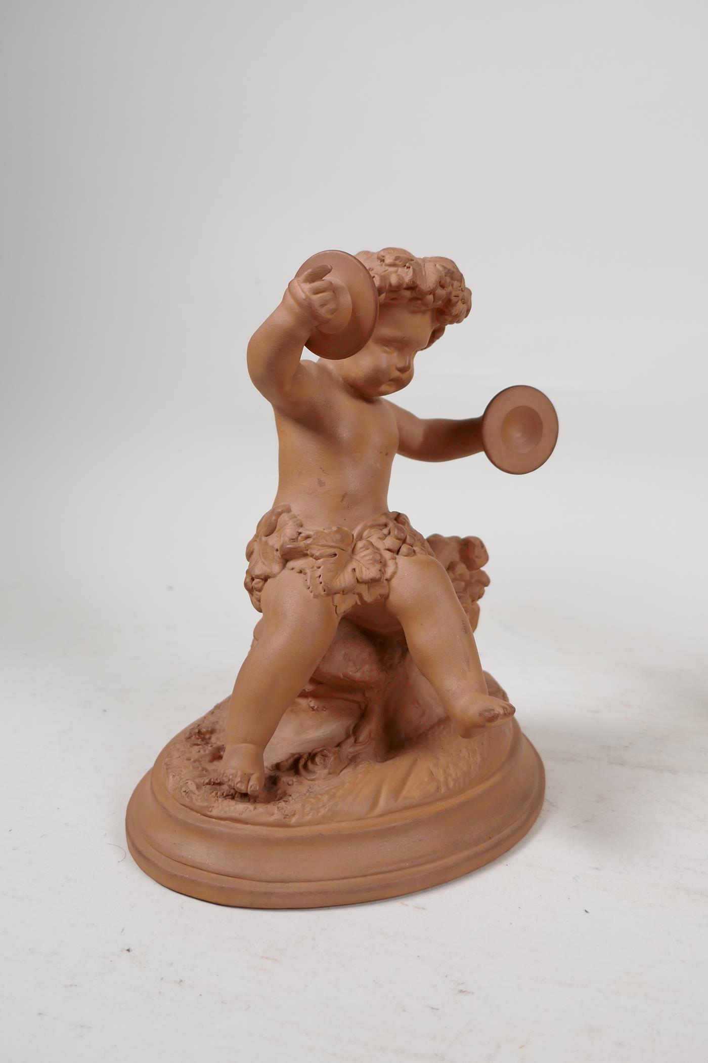 A mid C20th Watcombe pottery terracotta figure of a putti playing cymbals, together with a Beswick - Image 3 of 8