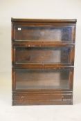 A Globe Wernicke oak three section bookcase, 34" x 12", 47½" high