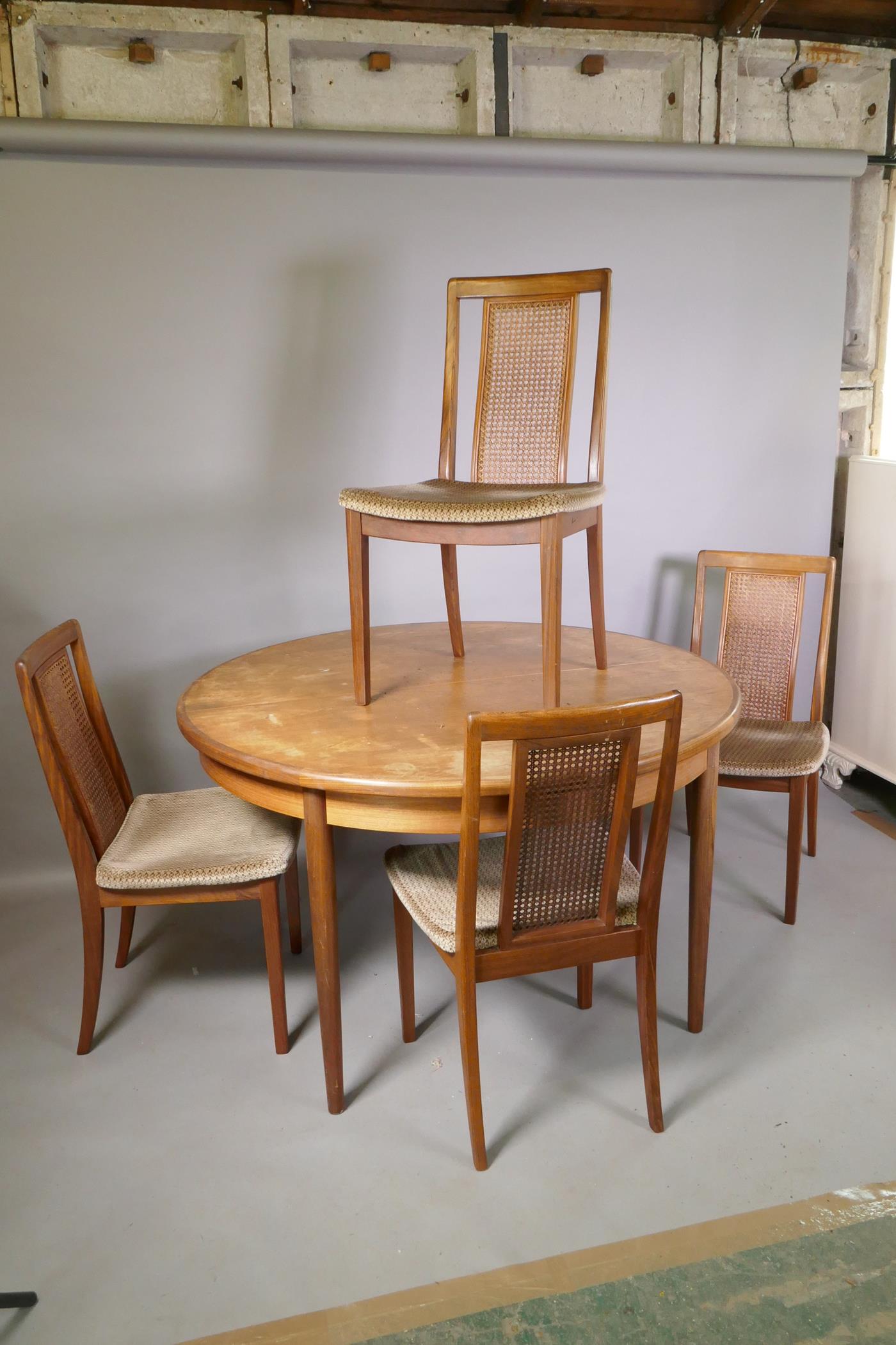A G-Plan teak dining table with fold out leaf, and four chairs, 1A/F, 48" diameter, 18" leaf - Image 2 of 5