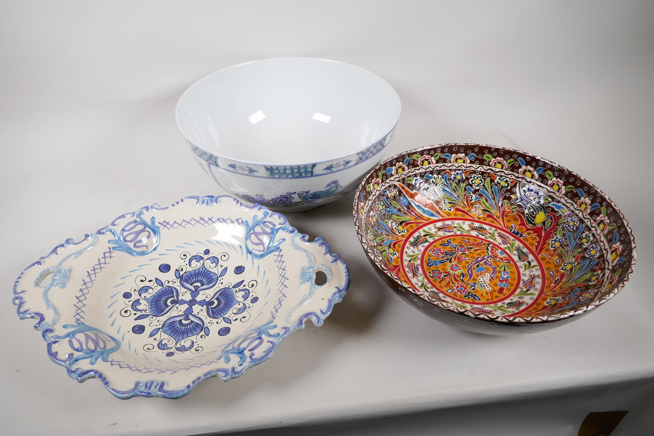A Chinese porcelain bowl decorated with flowers, 12" diameter, a brightly coloured bowl in the style