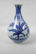 A Ming style blue and white porcelain pear shaped vase decorated with foliage, Chinese six character