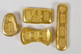 Four Chinese gilt metal trade tokens/ingots, impressed marks, longest 3½"